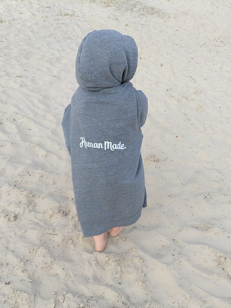 Toddler in hoodie labelled Human Made, the company name of one of my former employers