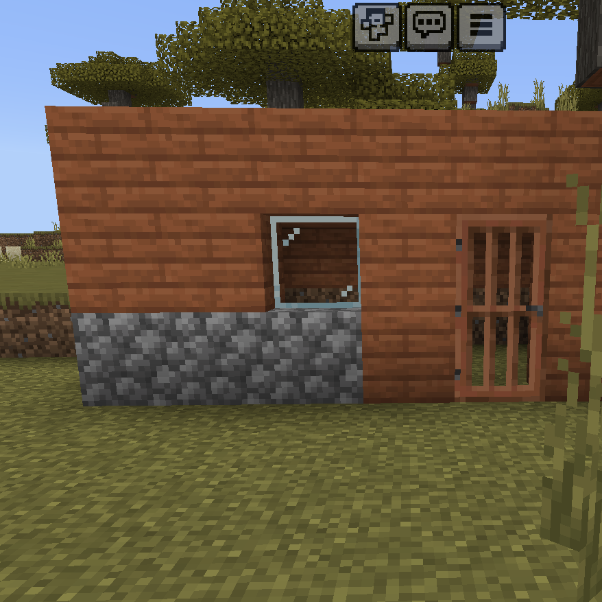 Very basic Acadian block shelter with a stone fundament, front door and window, standing under Acadia trees in Minecraft.
